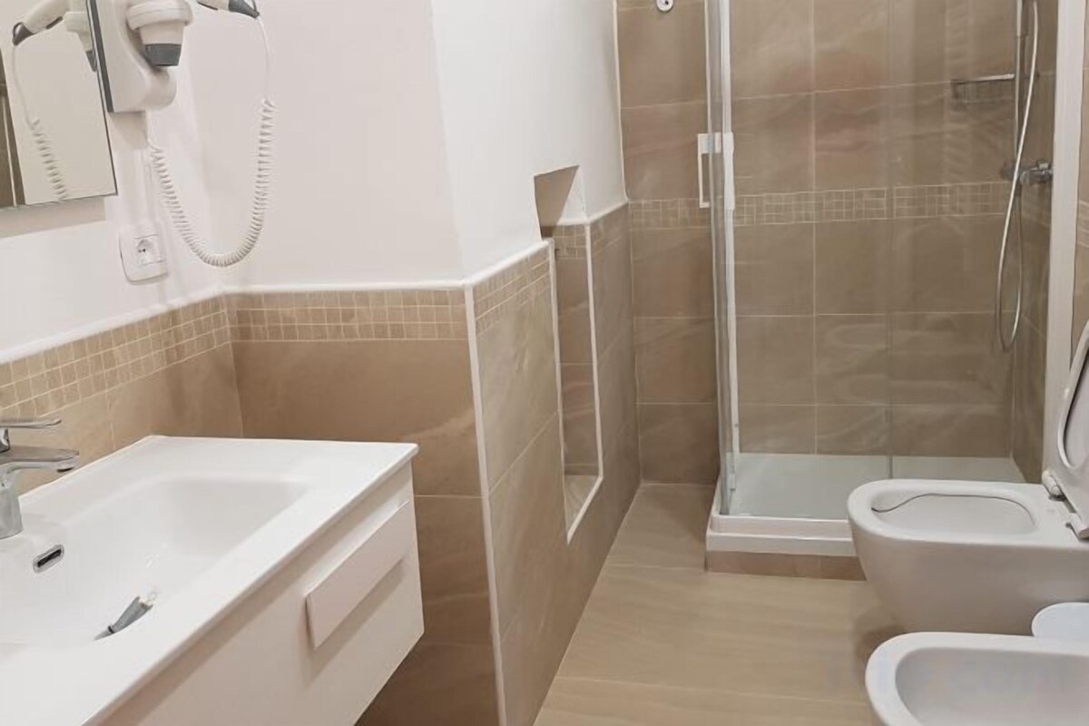 Bathroom | Shower, hair dryer, bidet, towels