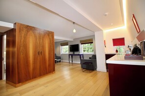 Apartamento superluxo | Área de estar | TV de tela plana