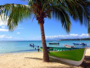 On the beach, sun-loungers