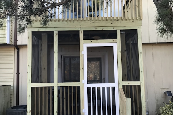 Back deck off of bedroom and screened-in deck off of living room.
