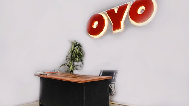 A reception desk with a sign that reads "OYO" in large letters.