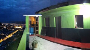 A multi-level building with a staircase leading to an upper floor. - ewwwwwwwww (Cusco)