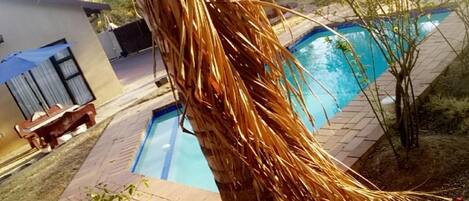 Outdoor pool, pool umbrellas, sun loungers