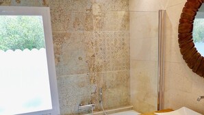 A modern bathroom with a freestanding bathtub, a wooden vanity, and a large mirror. - Guest Room in nature in Minorca : Adults Only (Ferreries)