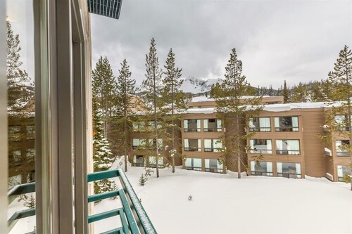 Ski-in/out condo with mountain view, hot tub, pool, & fireplace