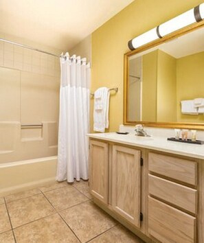 Combined shower/tub, hair dryer, towels, toilet paper