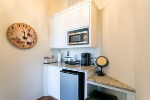 Fridge, microwave, coffee/tea maker, cookware/dishes/utensils