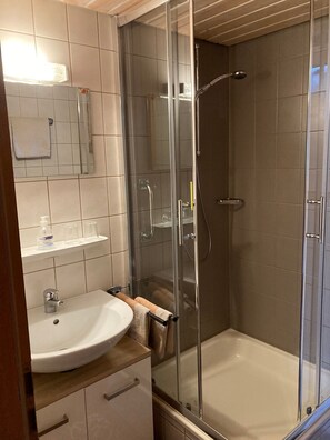 Shower, hair dryer, towels, soap