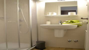 Shower, towels, soap, toilet paper