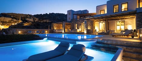 Luxury Studio Suite, Pool Access, Sea View | Living area | 55-inch Smart TV with digital channels, TV, Netflix