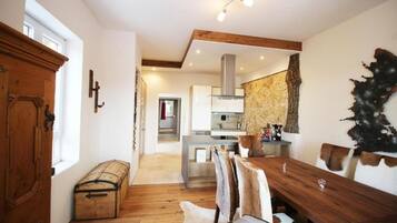 Deluxe Apartment, 2 Bedrooms | Living area | Flat-screen TV, MP3 dock, heated floors