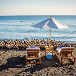 On the beach, sun loungers, beach umbrellas, beach towels