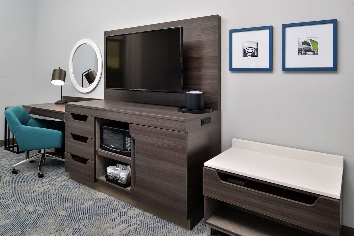 Desk, laptop workspace, blackout drapes, iron/ironing board