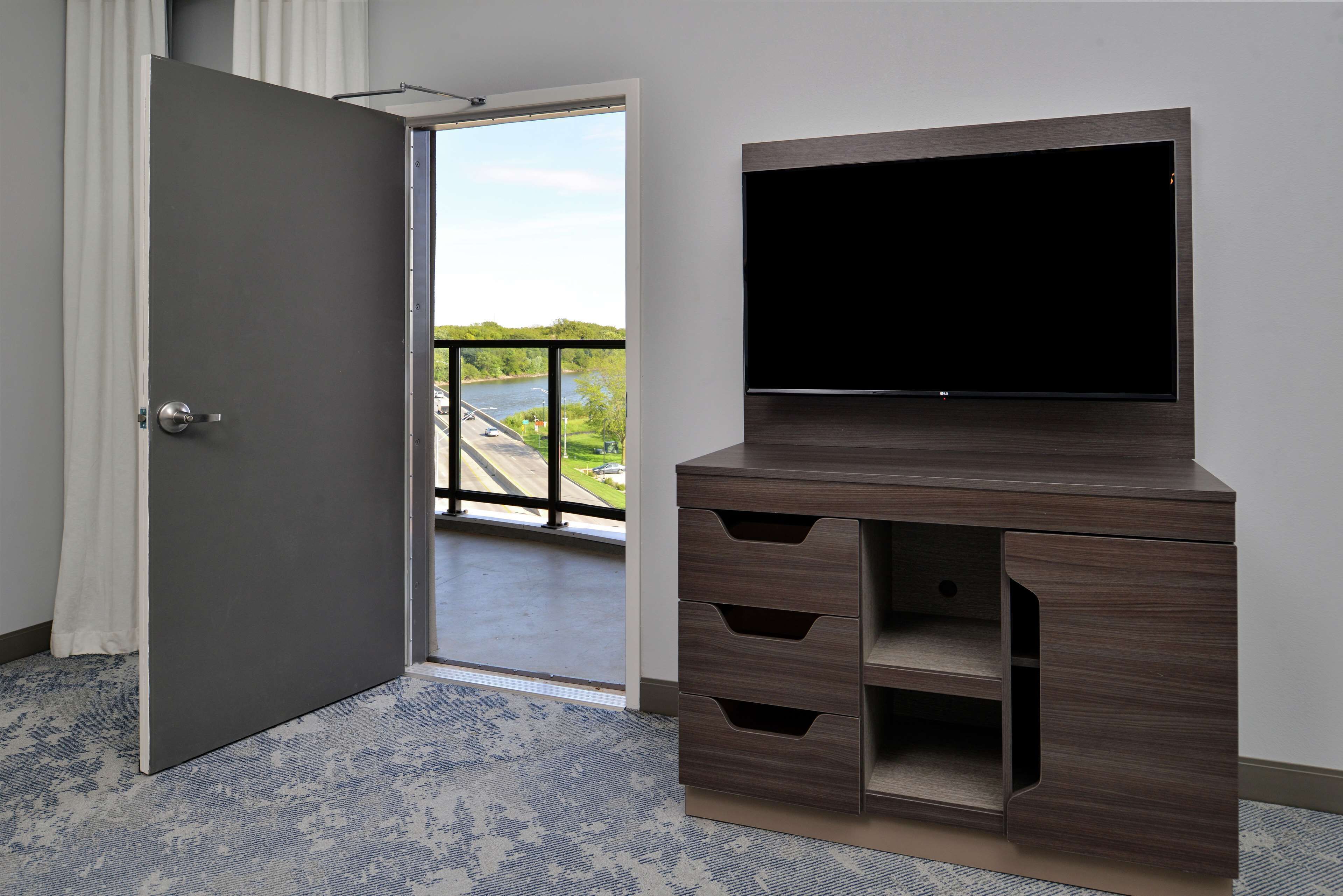 desk, laptop workspace, blackout curtains, iron/ironing board