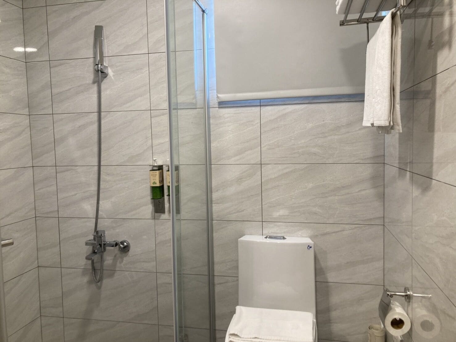 elite triple room | bathroom | shower, rainfall showerhead, free toiletries, hair dryer