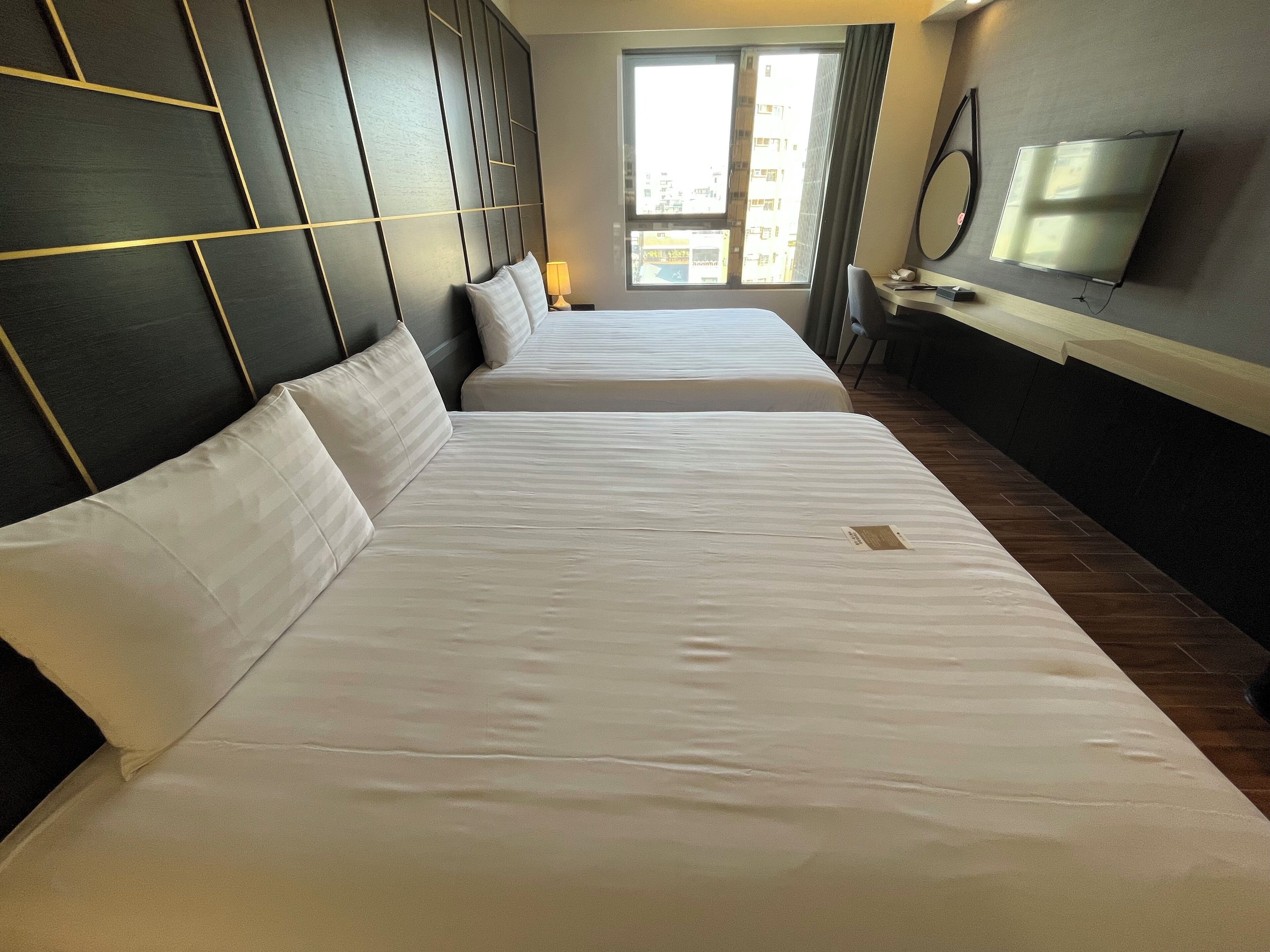 deluxe quadruple room | premium bedding, down duvets, individually decorated, desk