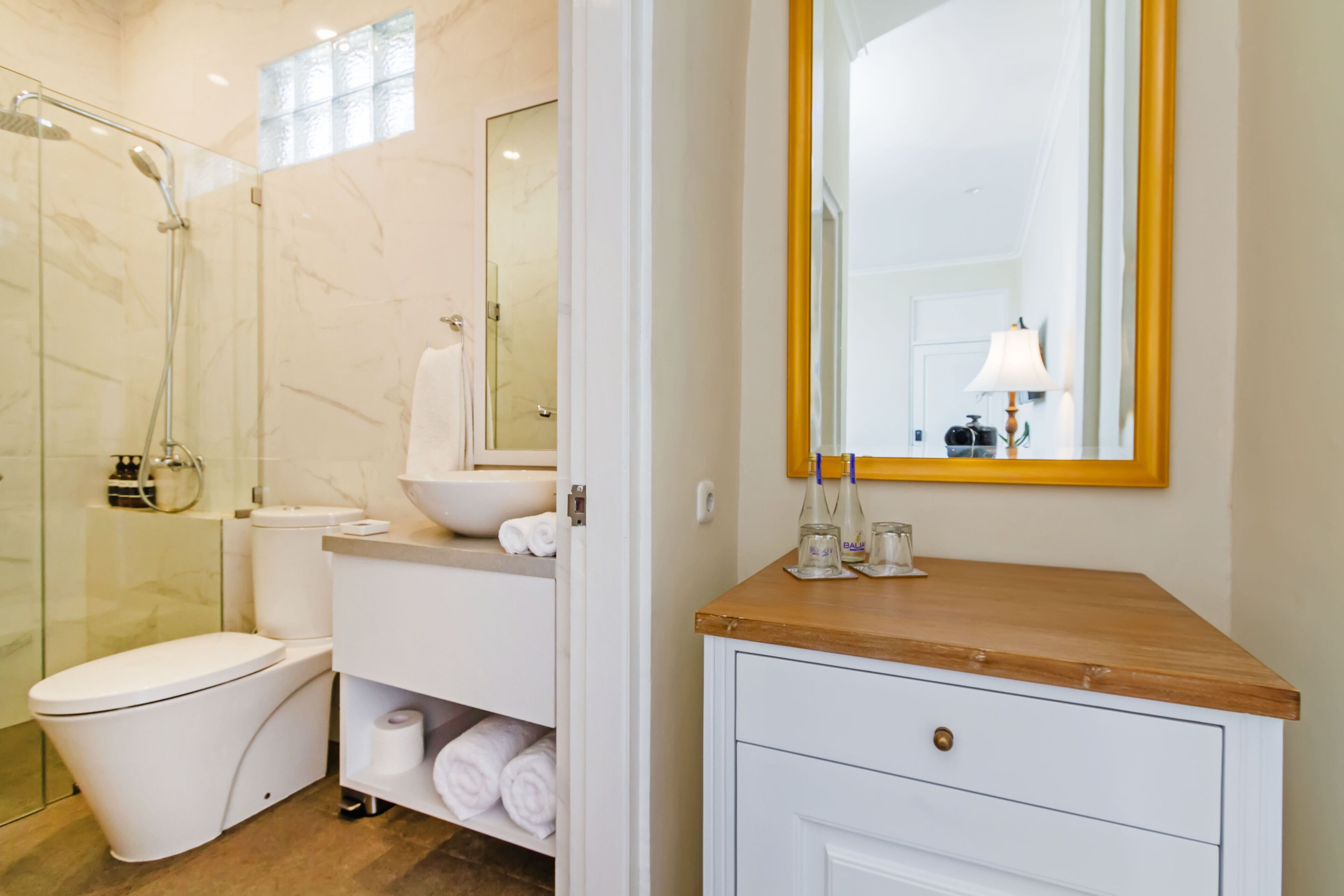 shower, hair dryer, slippers, towels