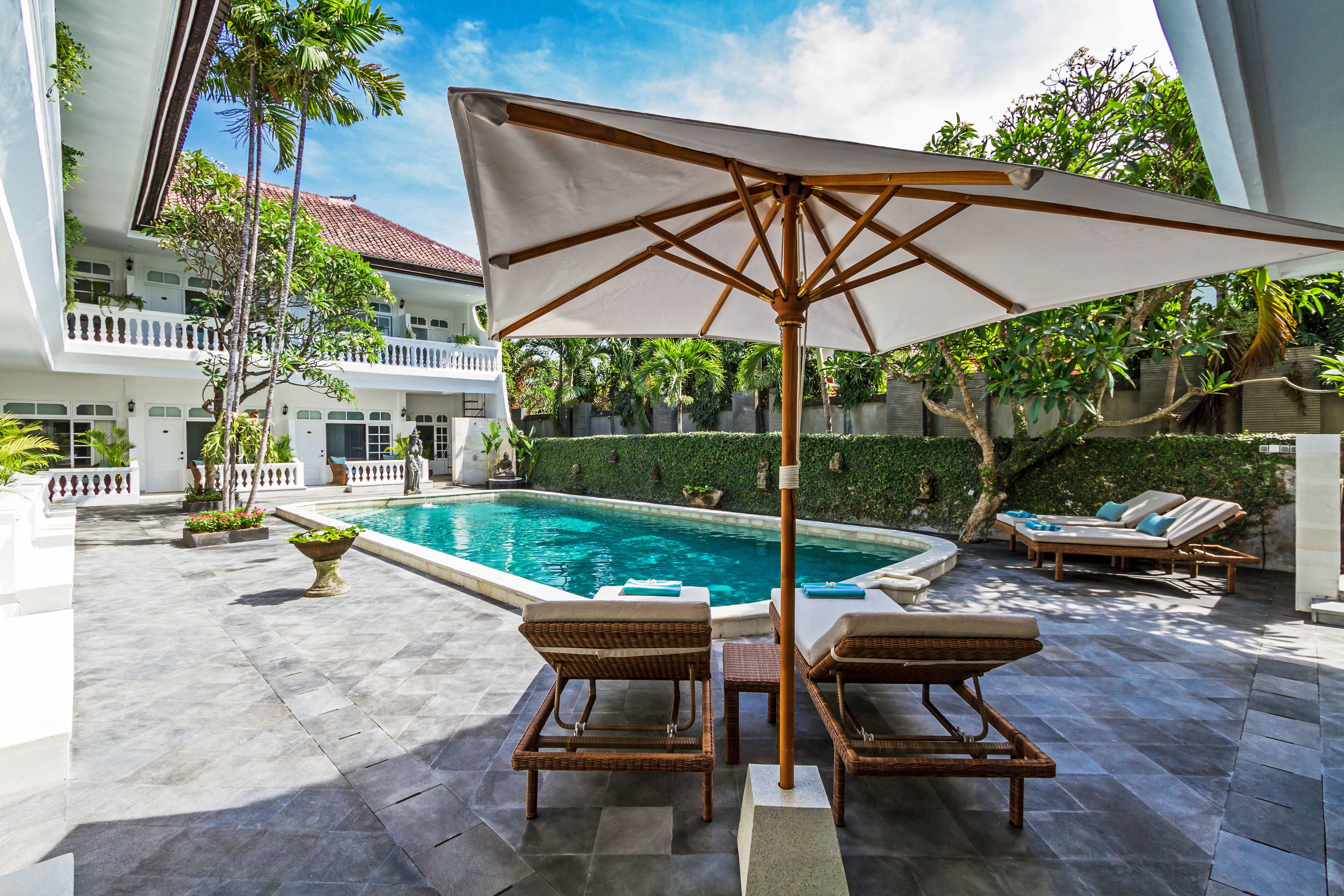 outdoor pool, open 6:00 am to 8:00 pm, pool umbrellas, pool loungers