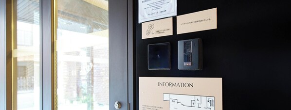 A wall with informational signs and a floor plan, including a hand icon and a wheelchair symbol. - Rakuten STAY URBAN Osaka Higobashi (Osaka)