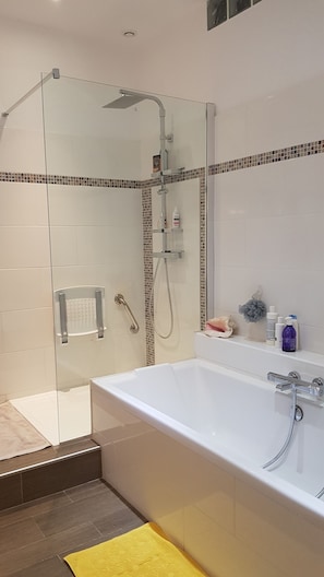 Bathtub, hair dryer, towels, soap