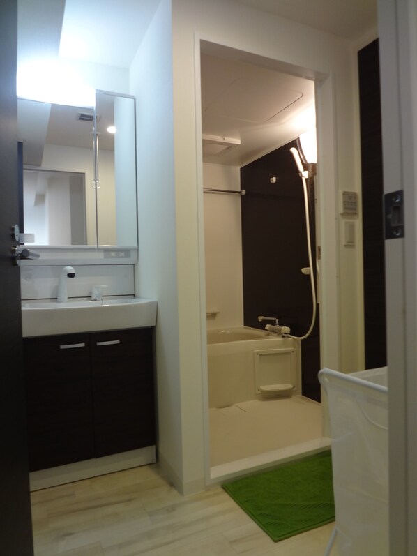 Separate tub and shower, free toiletries, hair dryer, slippers