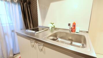 Fridge, microwave, stovetop, cookware/dishes/utensils