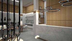 Un interior moderno con área de cocina, comedor y barra.