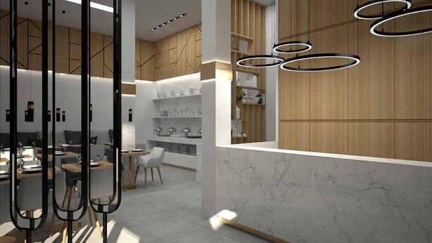 Un interior moderno con área de cocina, comedor y barra.