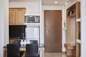 Apartamento standard | Opções para refeição no quarto