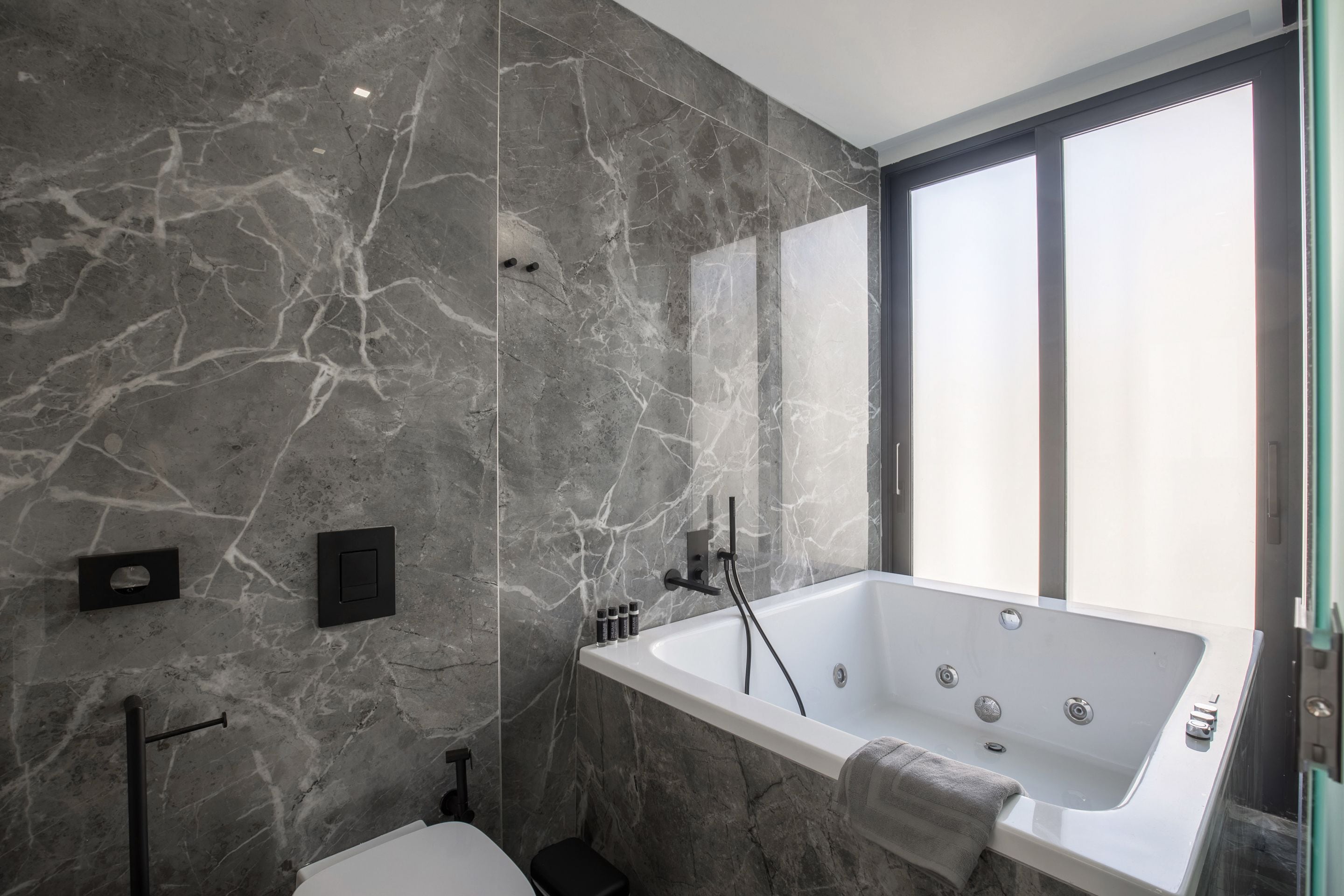 executive suite, 1 bedroom, jetted tub (front view, 403) | bathroom | shower, free toiletries, hair dryer, bathrobes