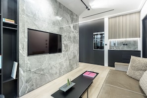 Luxury Suite, 1 Bedroom (Front View, 104) | Living room | Smart TV