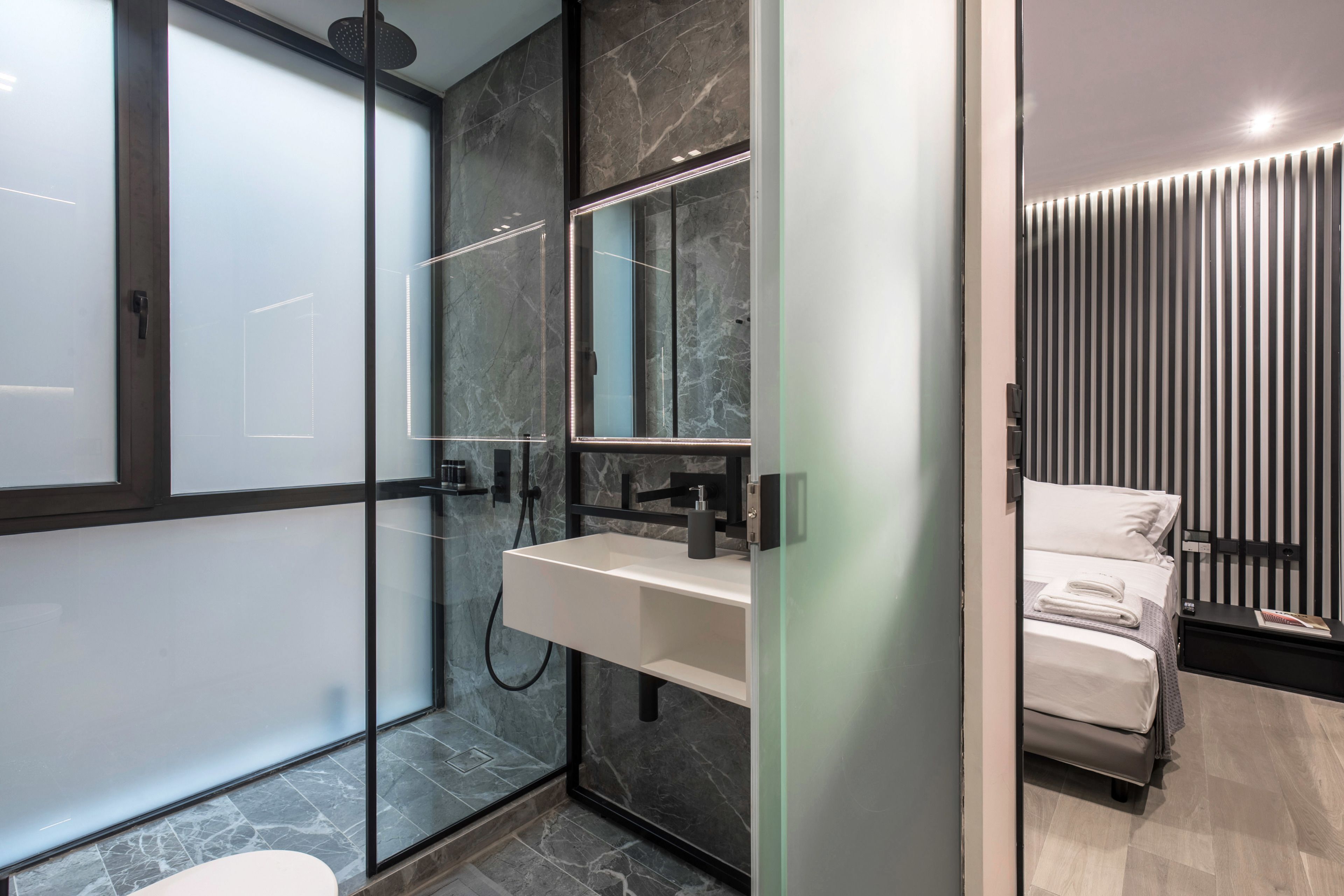 luxury suite, 1 bedroom, hill view (102) | bathroom | shower, free toiletries, hair dryer, bathrobes