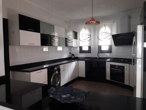 Villa | Private kitchen | Full-size fridge, microwave, oven, stovetop