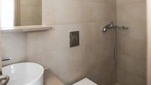 A bathroom with a sink, toilet, and shower. - Lovely Studio In Mykonos Old Town (Mykonos)