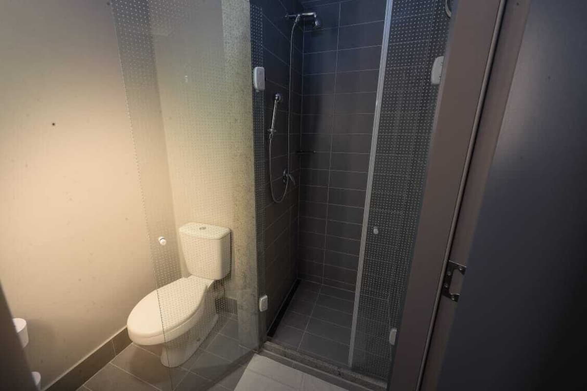 shower, rainfall showerhead, eco-friendly toiletries, towels