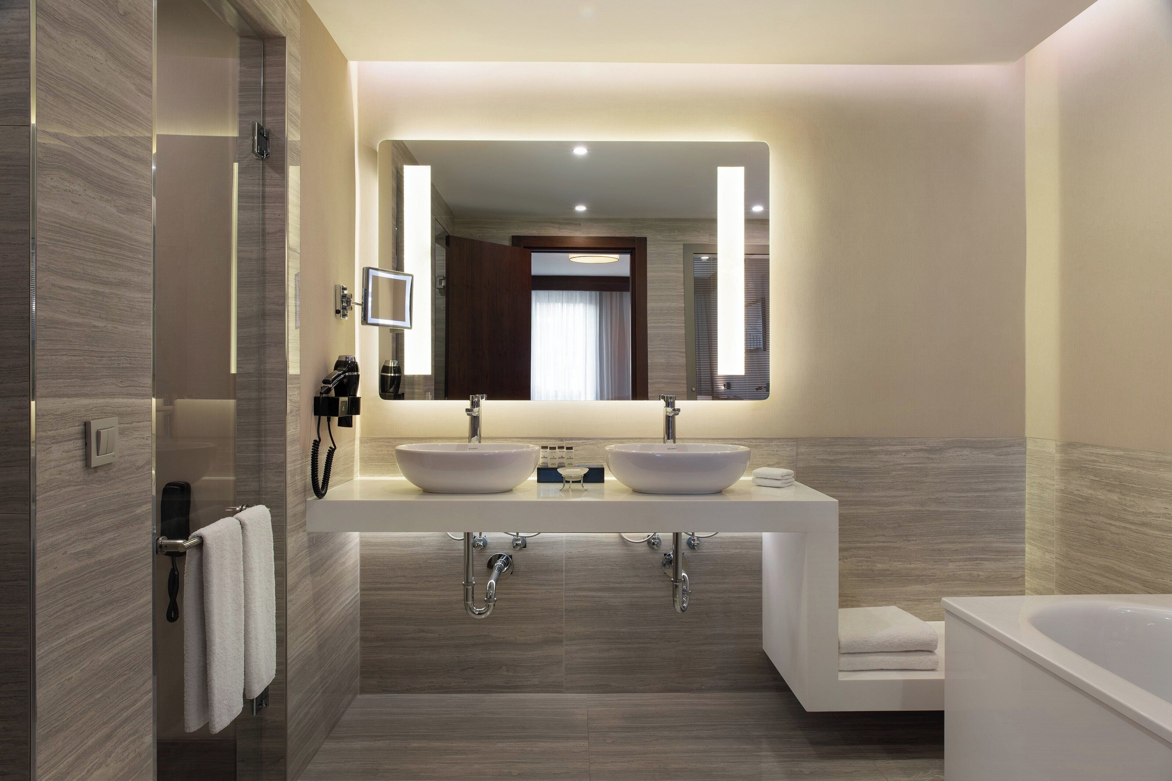 junior suite, 1 king bed with sofa bed | bathroom | combined shower/bathtub, eco-friendly toiletries, hair dryer, bathrobes