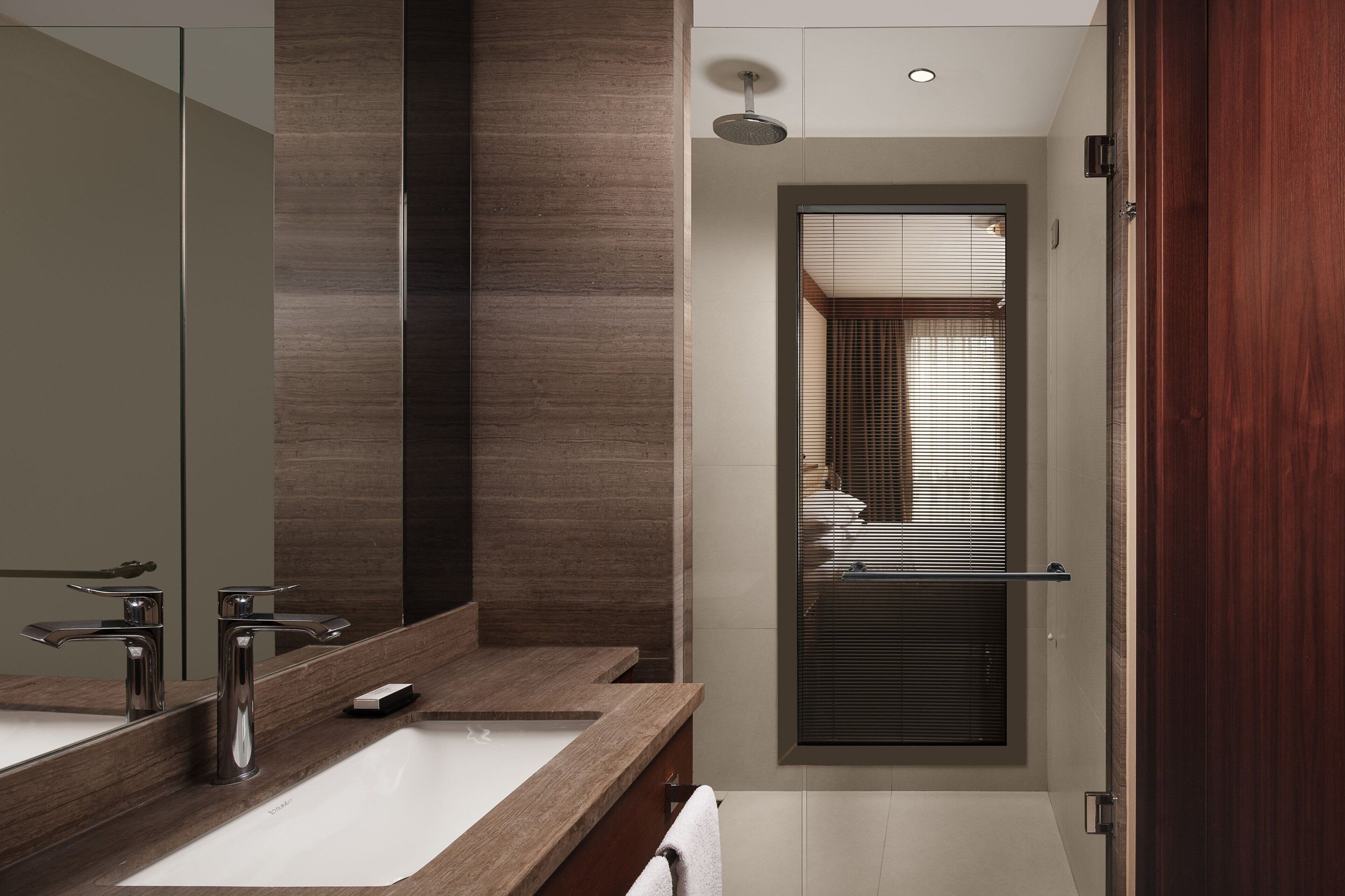 combined shower/bathtub, eco-friendly toiletries, hair dryer, bathrobes