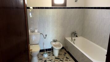 Villa | Bathroom | Separate tub and shower, rainfall showerhead, towels