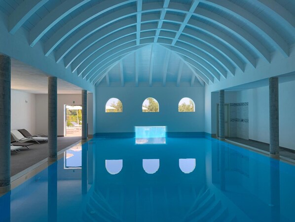 Indoor pool, seasonal outdoor pool, pool umbrellas, pool loungers
