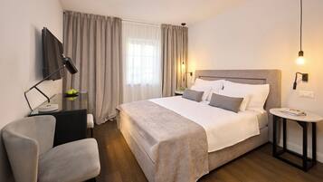 Premium bedding, down duvets, pillow-top beds, in-room safe
