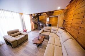 Deluxe Duplex | Living area | 80-inch LED TV with cable channels, TV