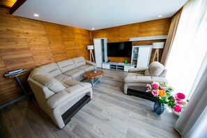 Deluxe Duplex | Living area | 80-inch LED TV with cable channels, TV