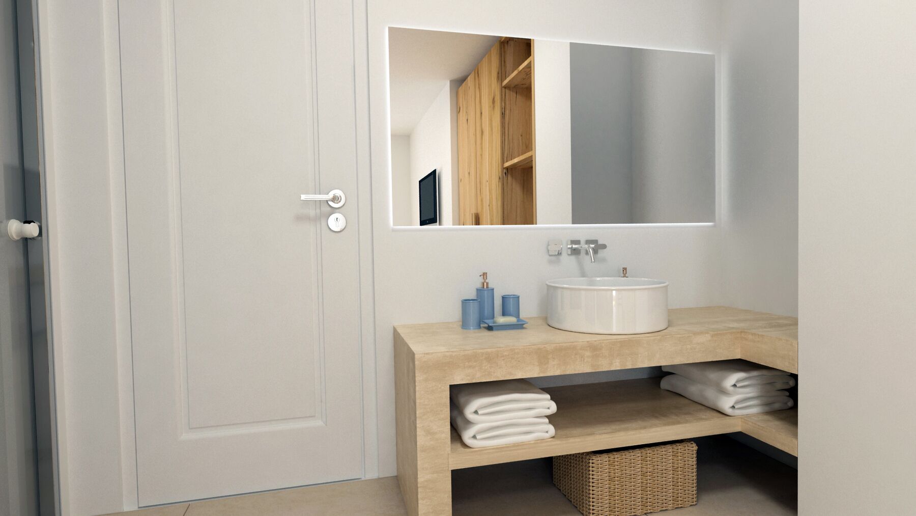 Un baño con una puerta blanca, un tocador de madera, un lavabo blanco y un espejo sobre el tocador.