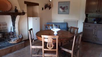 Apartment, 2 Bedrooms (Fiordaliso) | Living area | Fireplace, books