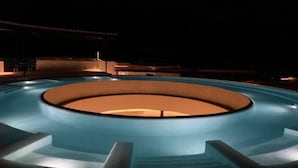 A circular pool with a central light feature, surrounded by steps and a low wall. - Romantic Penthouse Studio Get Away With Private Splash Pool- PENT HOUSE 3 B- By Salt-Kisses (Tulum)