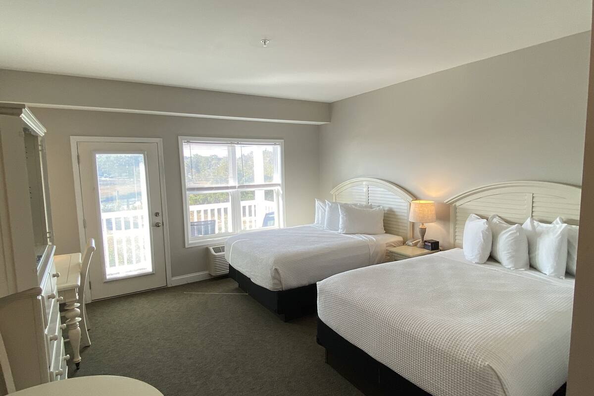 Premium bedding, pillow-top beds, desk, laptop workspace