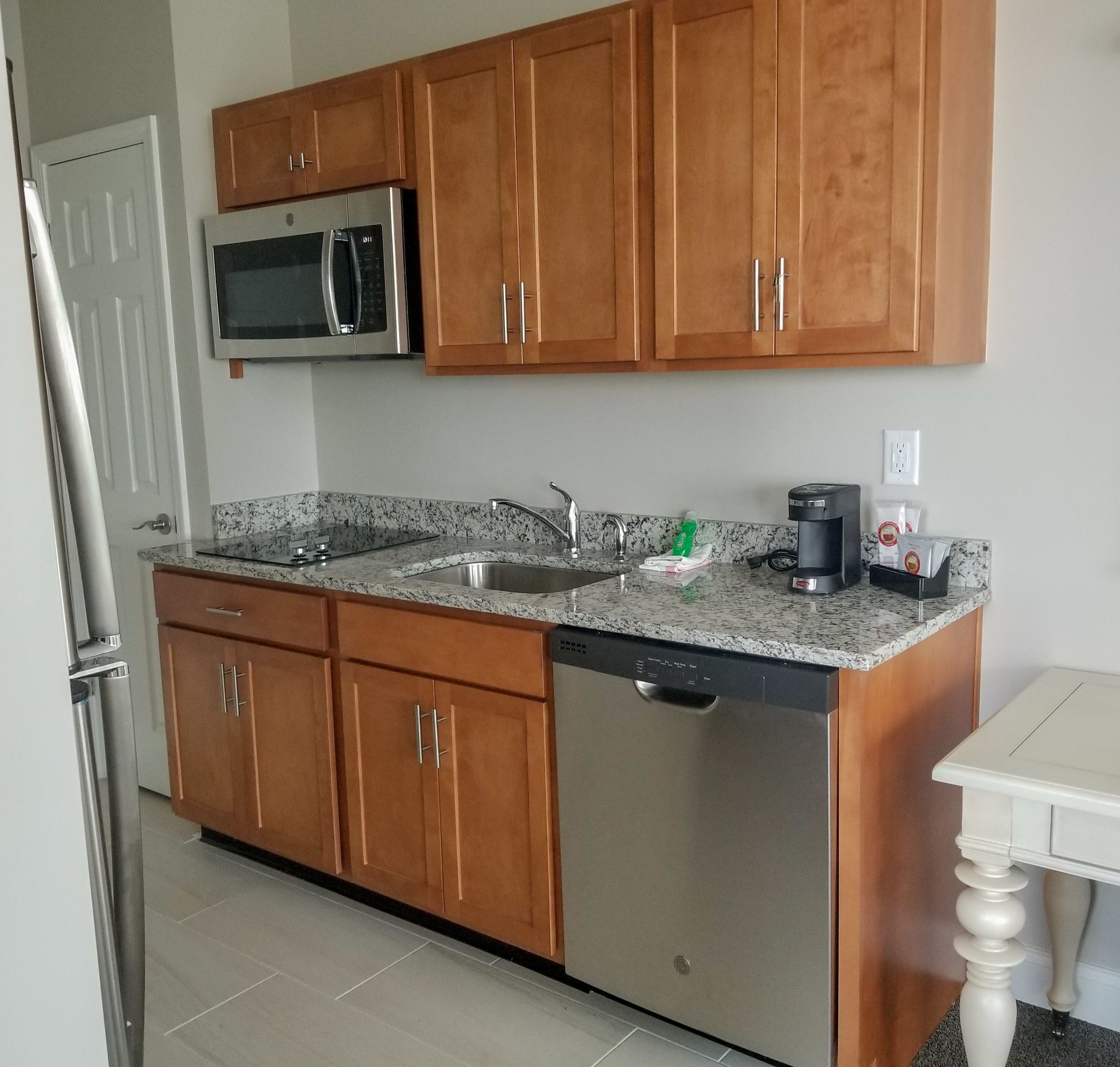 full-sized fridge, microwave, stovetop, dishwasher