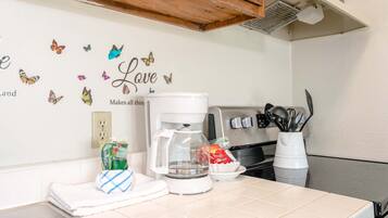 Fridge, microwave, stovetop, coffee/tea maker