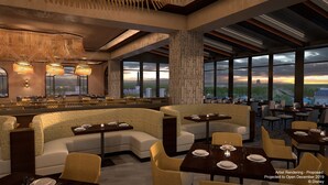 Un restaurante con una decoración moderna, ventanas amplias y vistas a la ciudad.