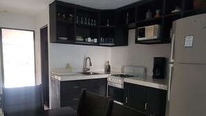 Junior Suite | Private kitchen | Coffee/tea maker, full-size fridge, microwave, oven - New Condo in the Hotel Zone (Cancun)